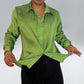 Man wearing a sustainable green shirt